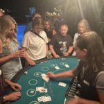 Elan dealing to women at a blackjack table